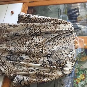 Chico’s Animal Print Bat Wing Shirt 97% polyester, 3% spandex.  Easy Care.